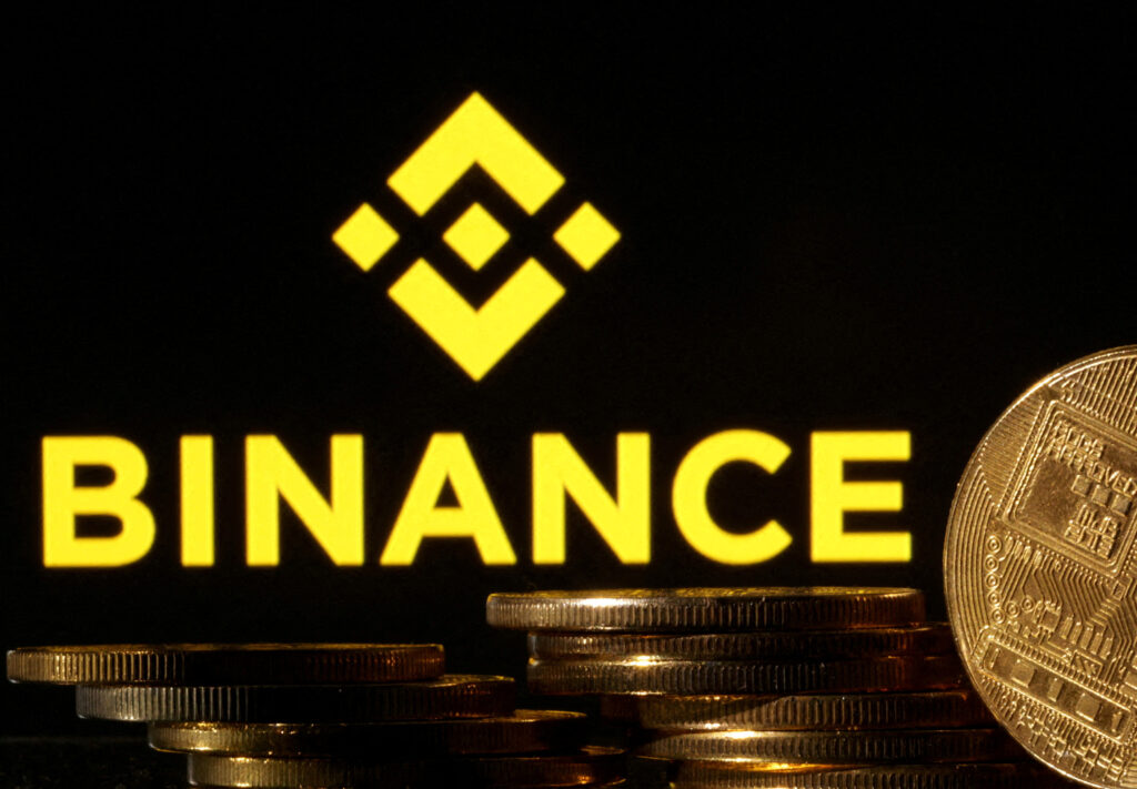FILE PHOTO: A composition showing crypto currency with the Binance logo. Picture taken on Nov. 10, 2022. REUTERS/Dado Ruvic